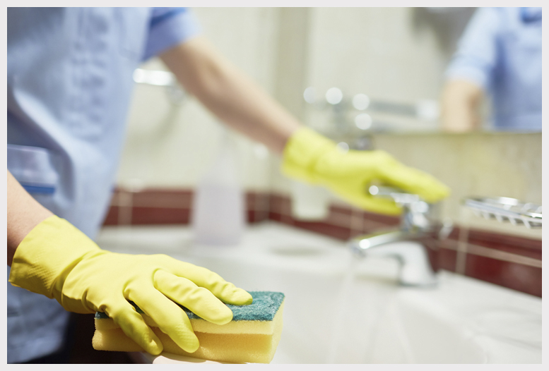 Man cleaning carpets in home